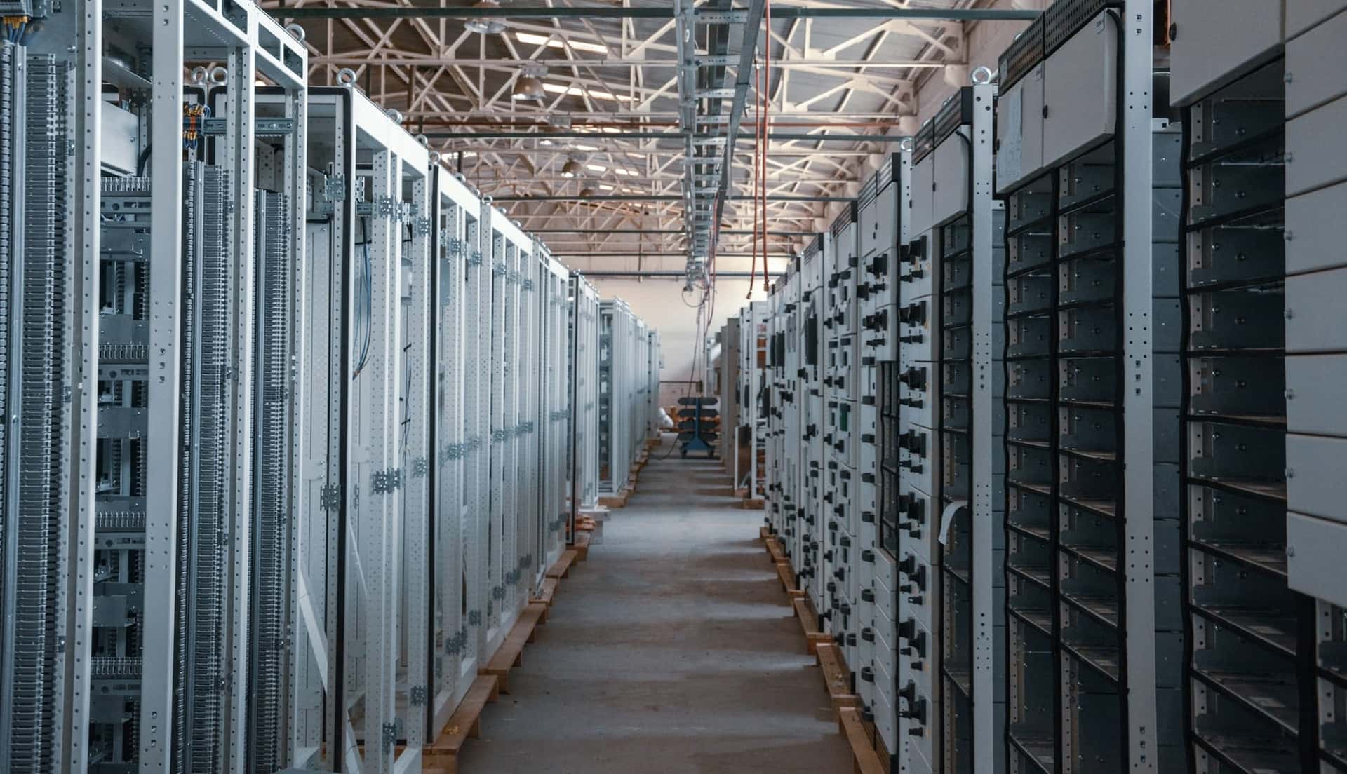 Aisle of electrical cabinets in an industrial facility